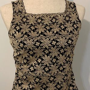 Karen Kane. Cream on black. Small elasticized shell.